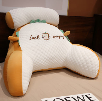 Cute cartoon-shaped pillow with embroidered text on a plain background