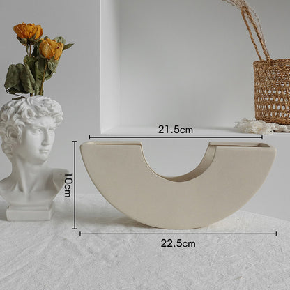 Decorative half-circle shelf with measurements on a neutral background