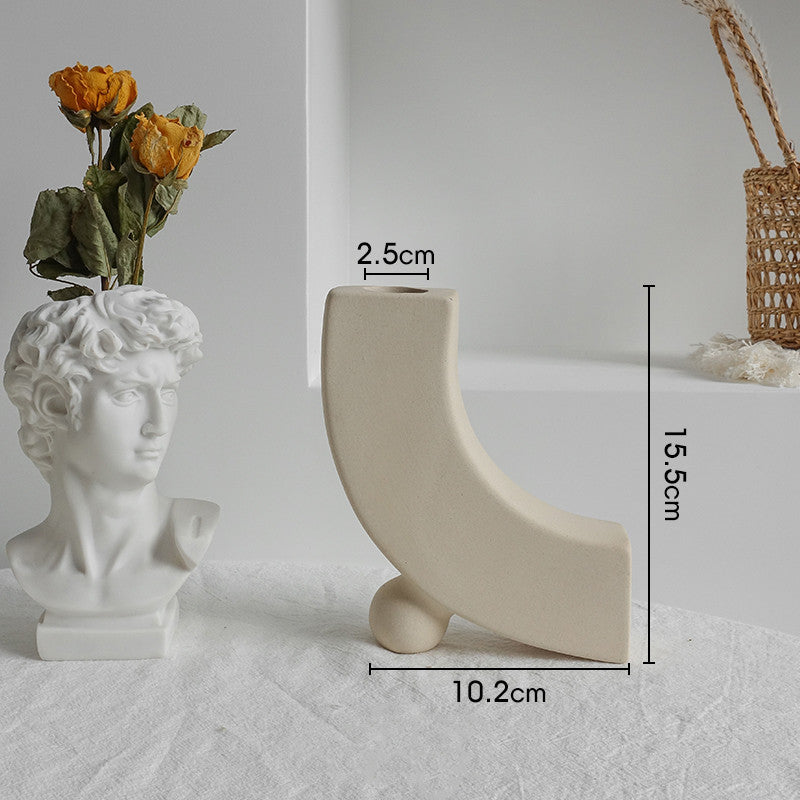 Two decorative vases with measurements on a light gray surface