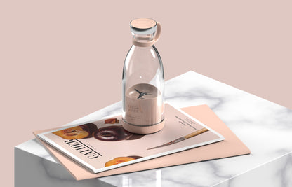 Glass bottle with a metallic cap on a magazine with a pink background