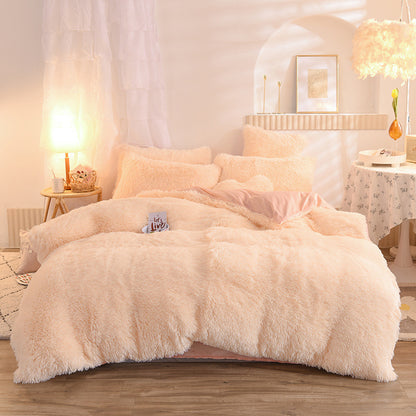 Fluffy beige comforter set on a bed in a cozy bedroom setting.