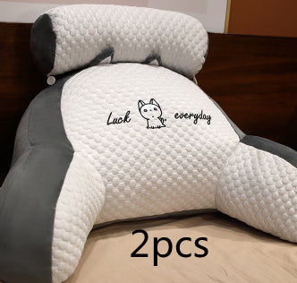 Two white and gray pillows with a logo and text on a wooden surface