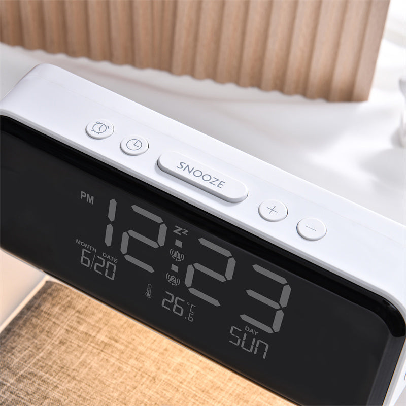 Digital clock with time display on a bed
