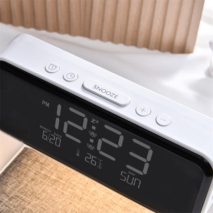 Digital clock with time display on a bed