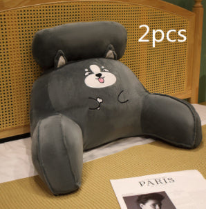 Two gray plush dog-shaped pillows on a wooden surface with '2pcs' text above.