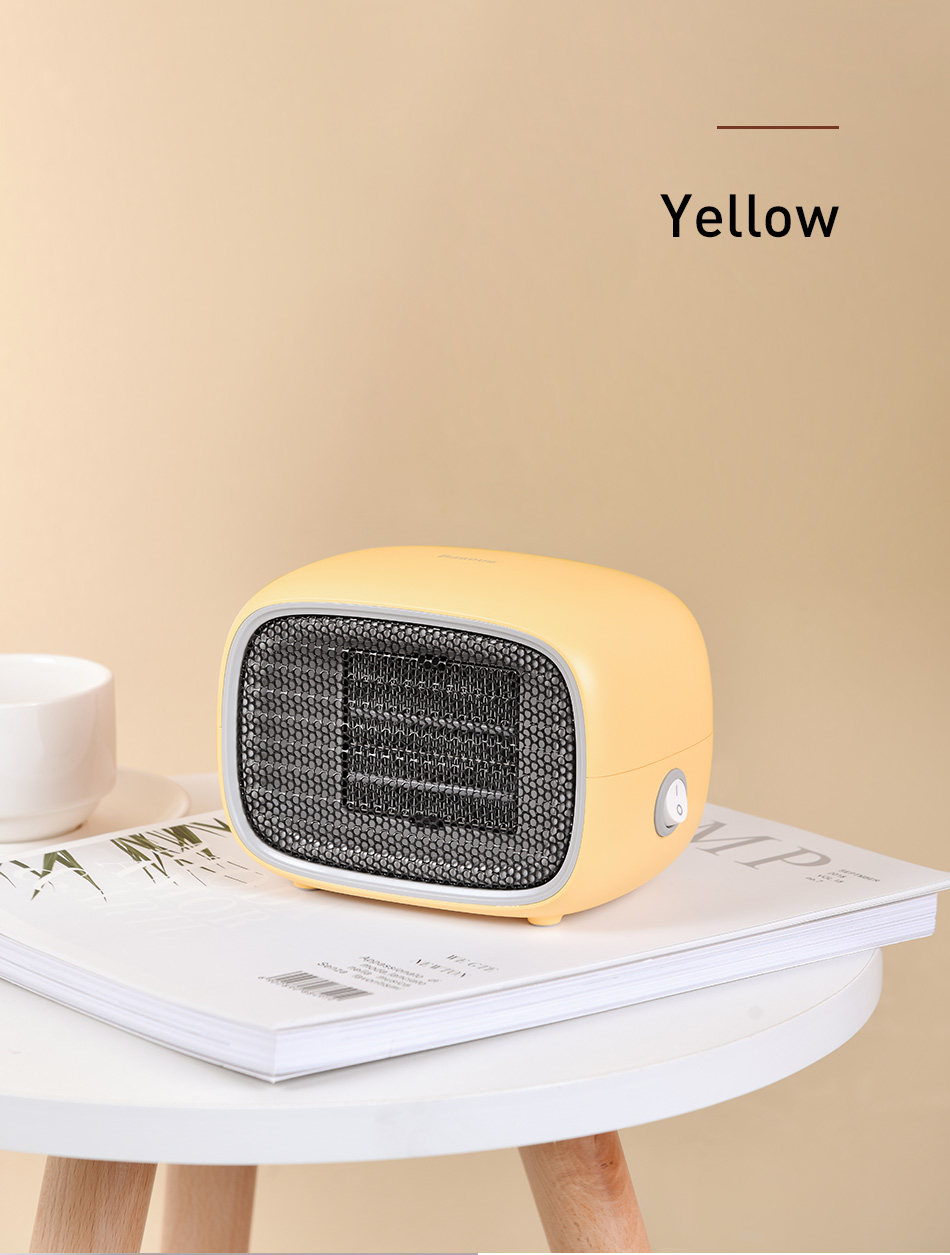 Yellow small heater on a table with a beige background