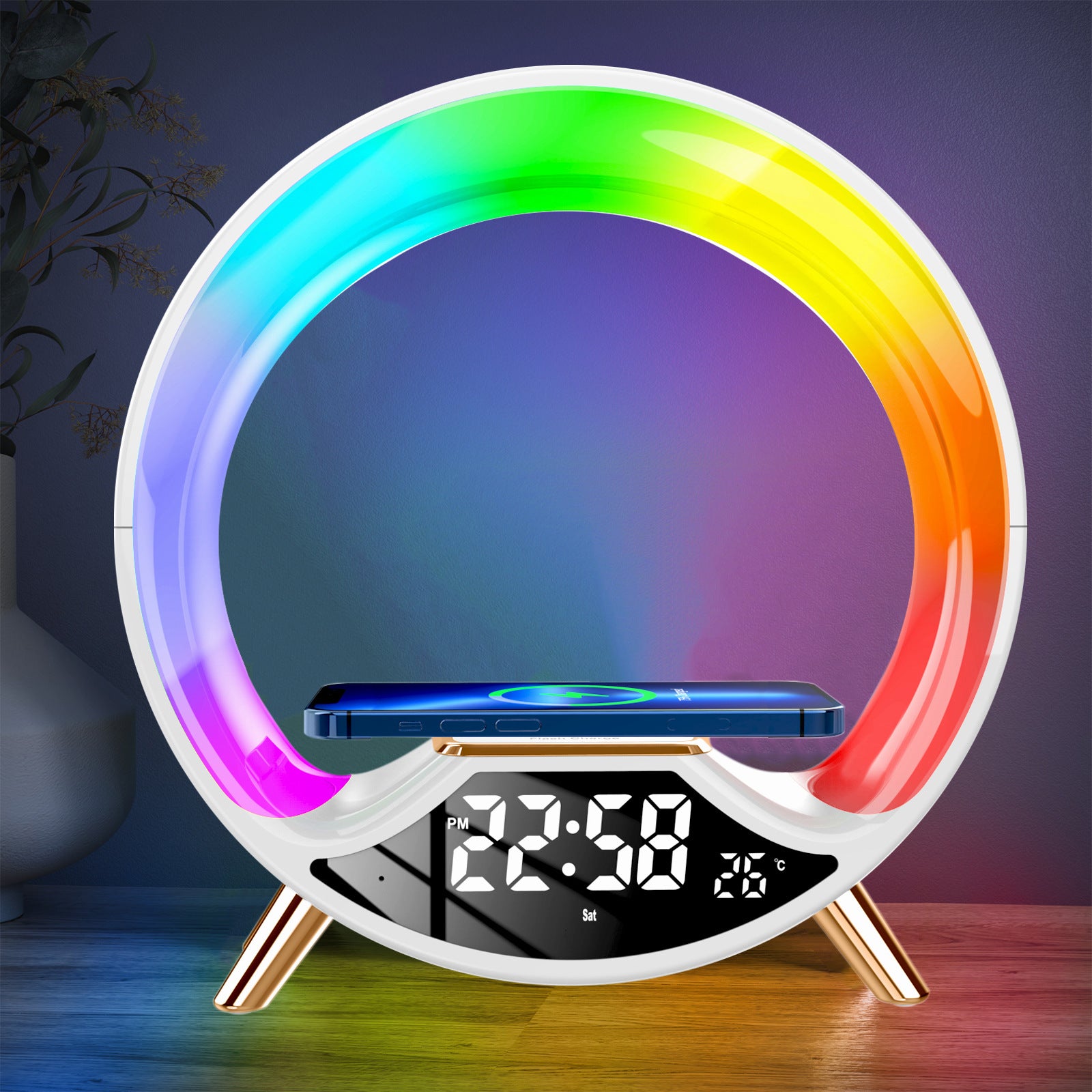 Colorful circular LED lamp with digital clock and phone stand on a dark background