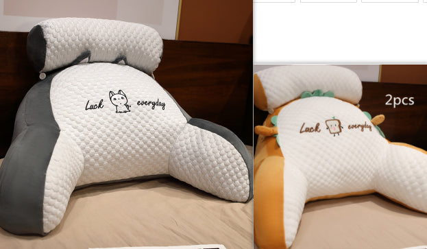 Neck pillow with 'Luck everyday' text on a bed