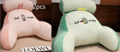 Two cartoon character cushions with embroidered text on a LOEWE surface.