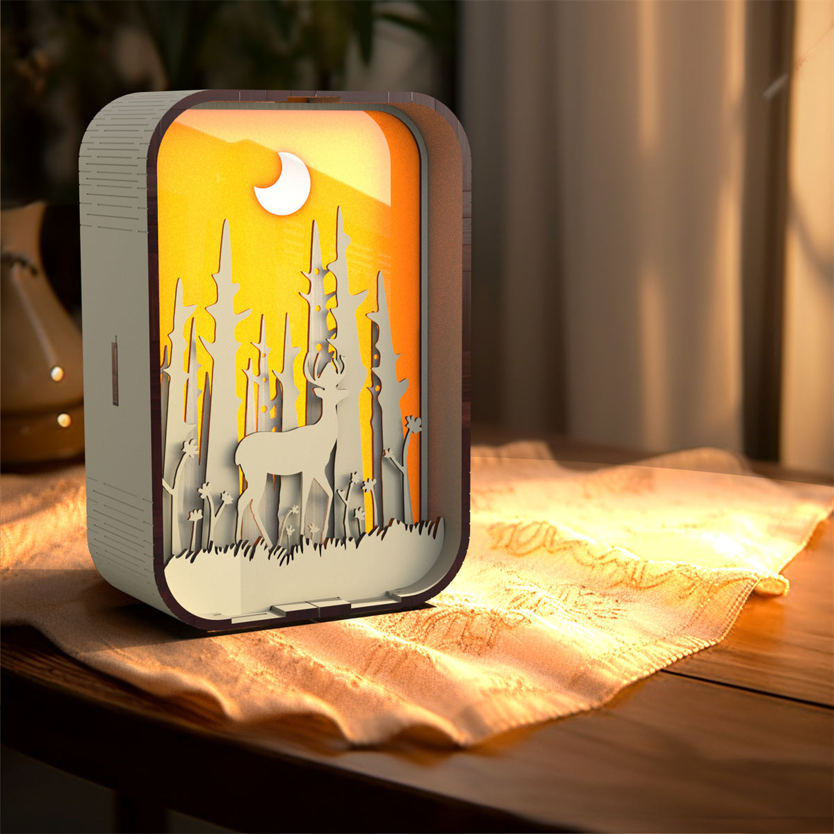 Decorative lamp with deer design on a wooden surface