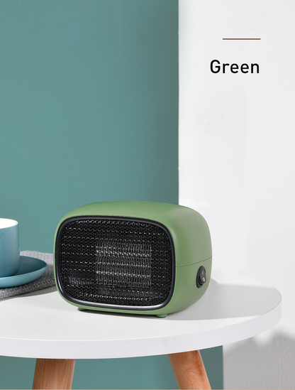 Green portable heater on a white table against a teal wall
