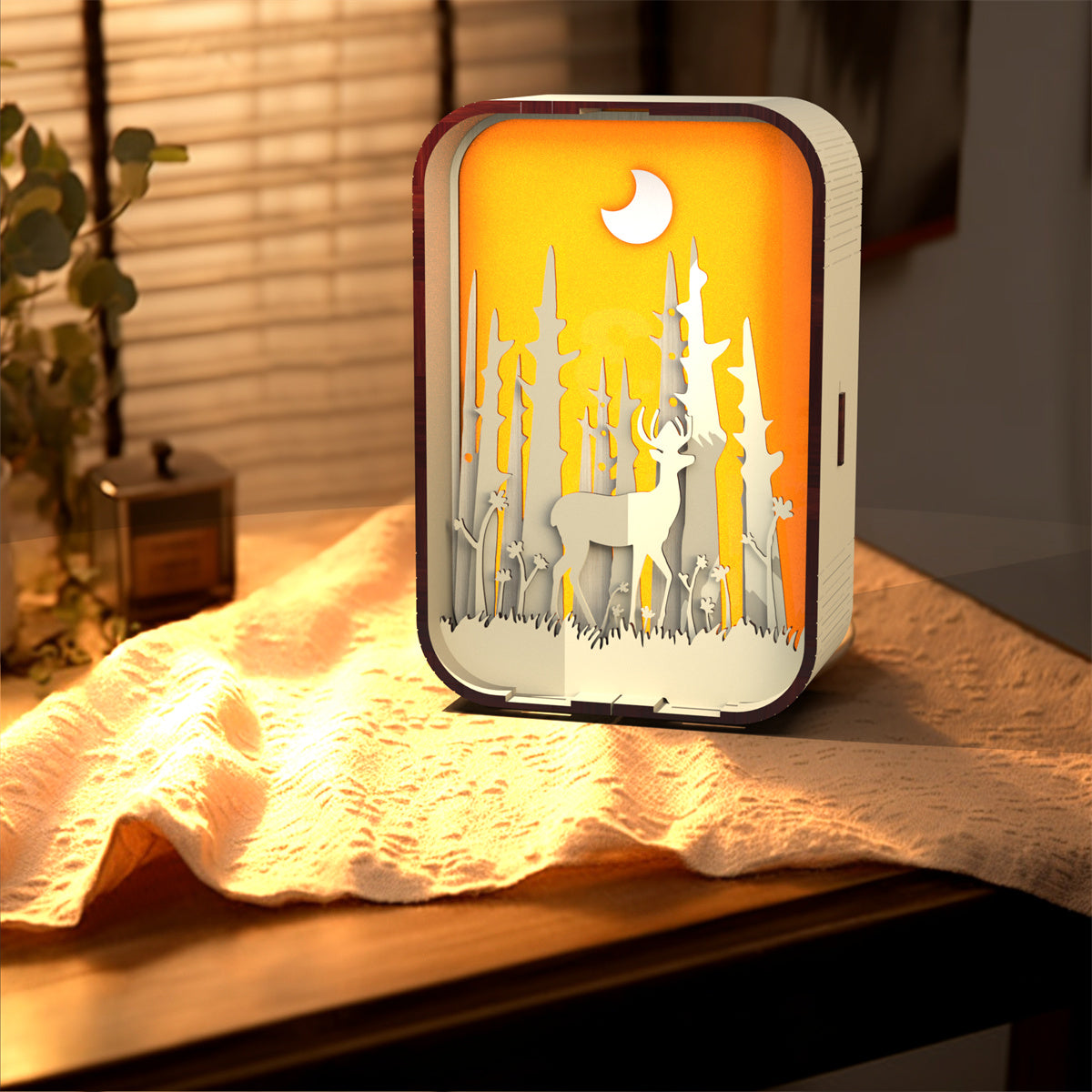 Decorative night light with animal silhouettes on a wooden surface