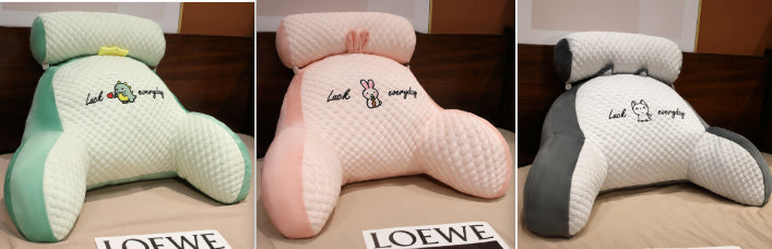 Three different colored pillows with 'Loewe' branding on a neutral background