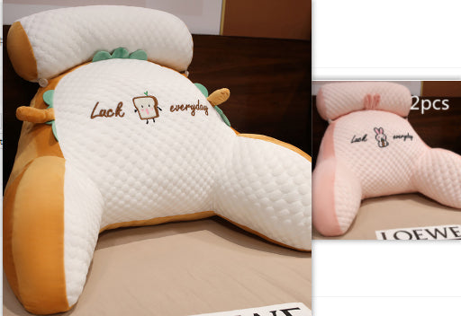 Two cartoon-themed headrest covers with embroidered text on a wooden surface.