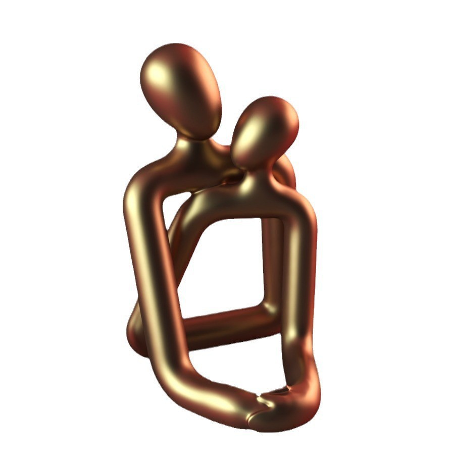 Bronze sculpture of two abstract figures embracing on a white background